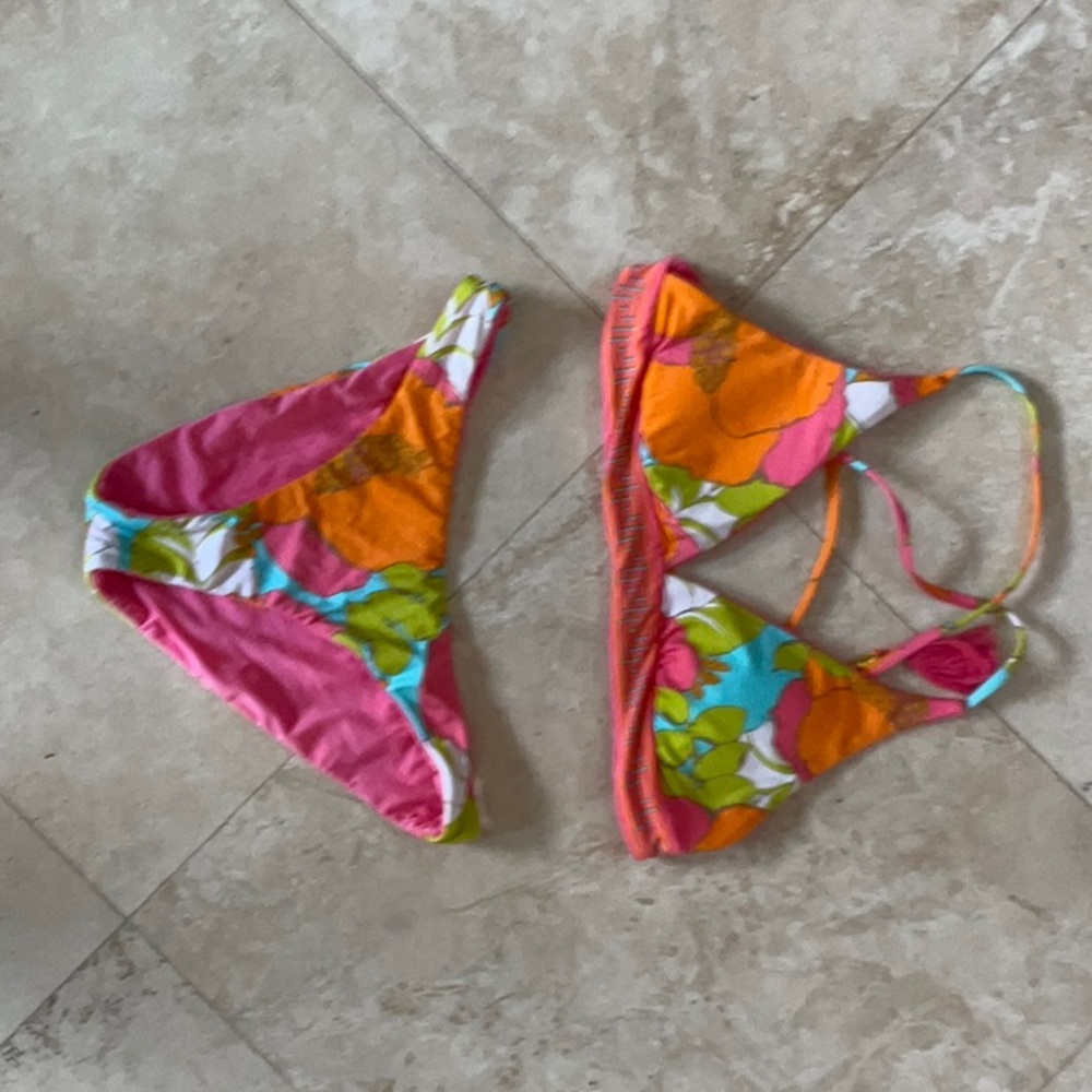 Trina Turk size 2 reversible bikini. Super cute tassels with gold accents.
